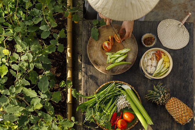 Photo of a woman preparing a meal from a table of ingredients.