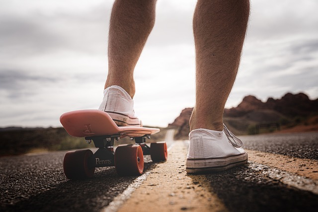 Photo of someone preparing to skateboard into the distance.